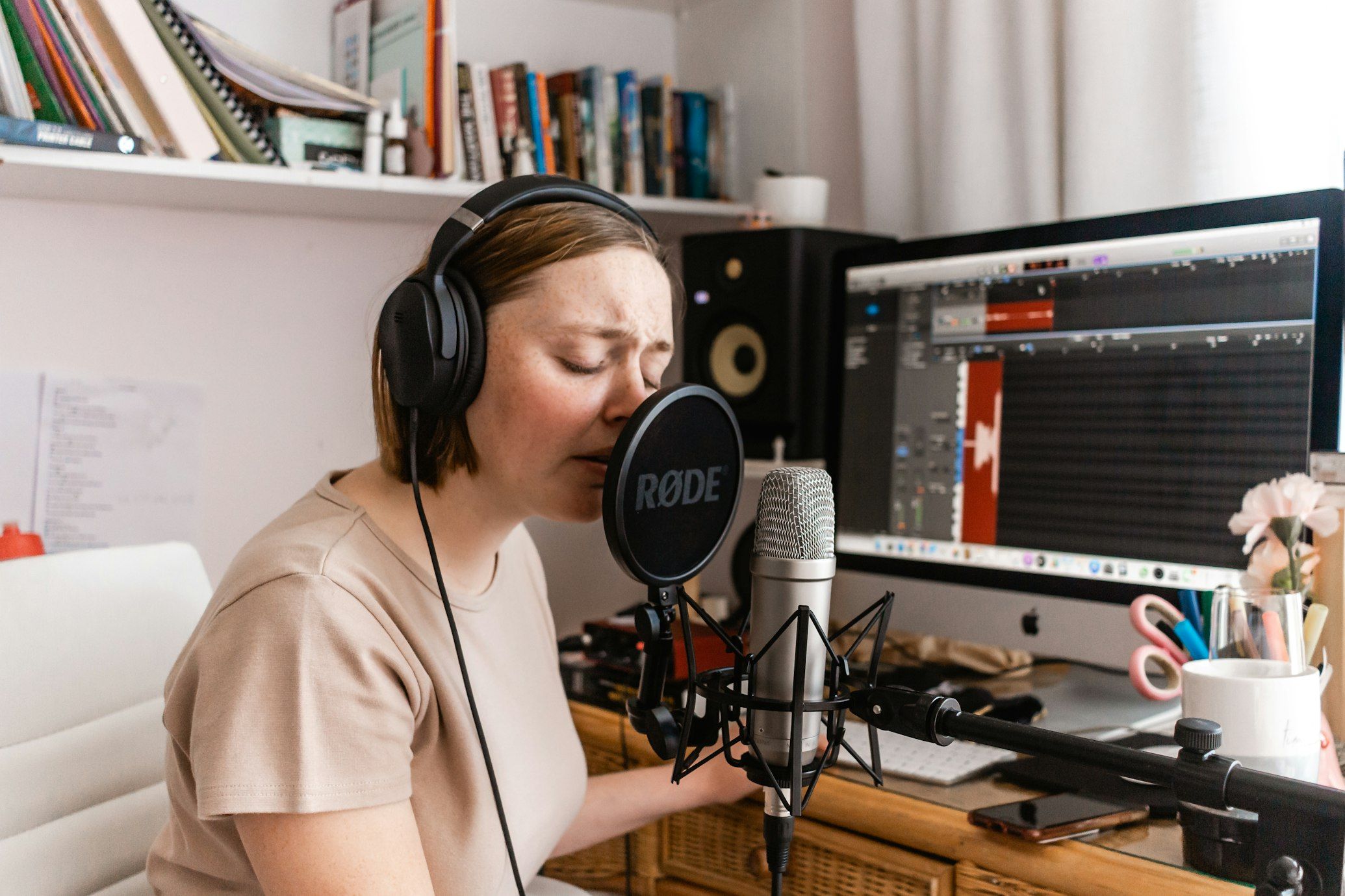 You can significantly improve the quality of your recordings by investing in essential equipment such as great microphones, pop filters, and acoustic treatment