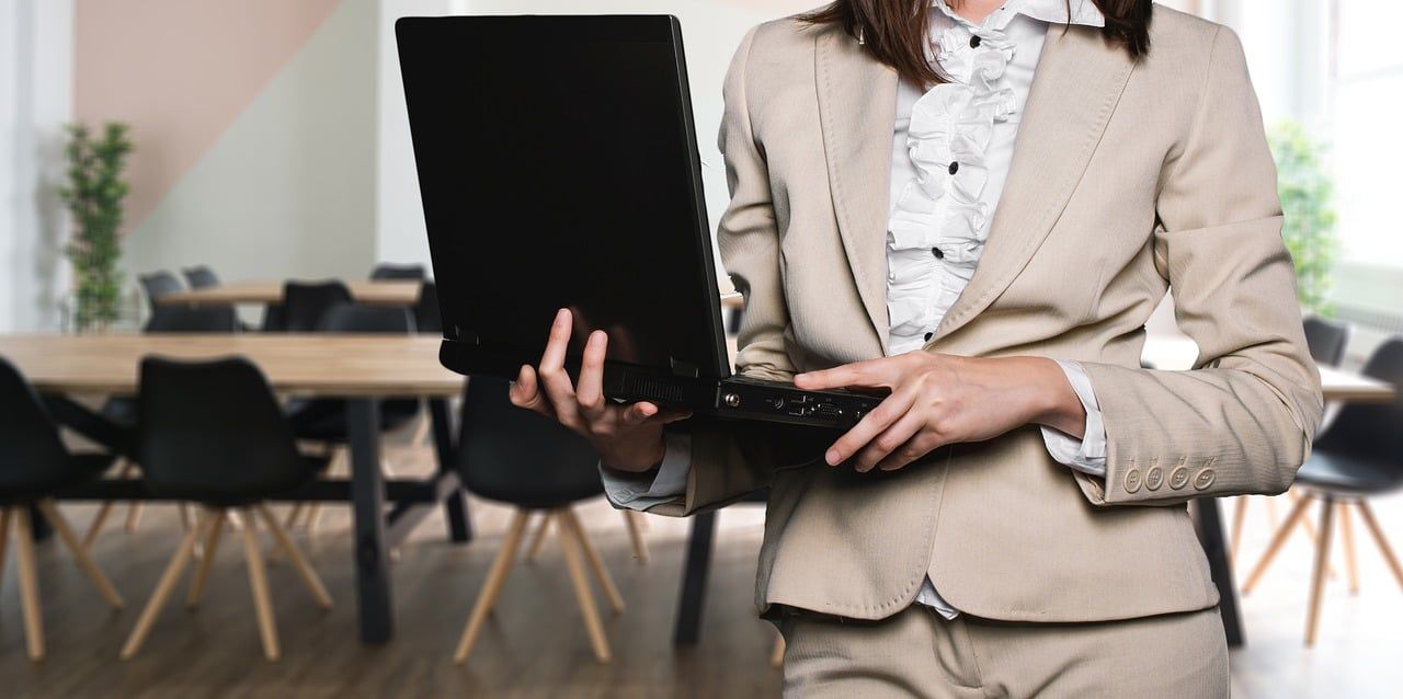 woman teaching a group of online students